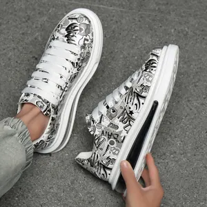 Men's fashion sneakers with graffiti print and oversized thick sole for urban style.
