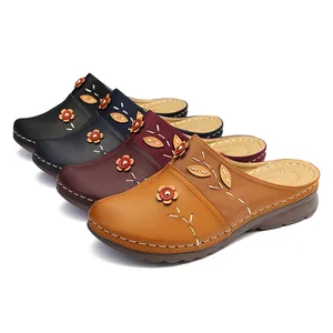 Detail view of floral flat closed-toe mules in four classic colors on white background