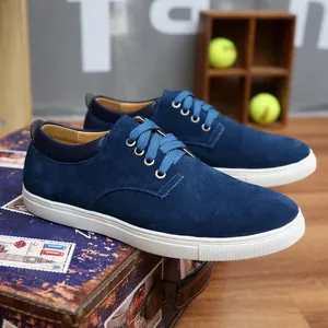 Premium men's navy blue suede leather casual sneakers featuring a clean white rubber sole