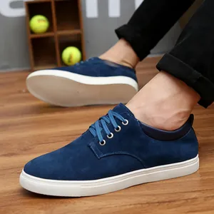 Stylish men's casual navy blue suede leather sneakers with a durable white sole