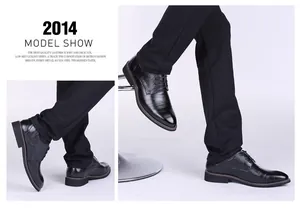Side profile detail of elegant black leather men's business dress shoes worn by model