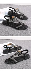 Detailed view of black rhinestone flower flat sandals with Bohemian hollow-out design