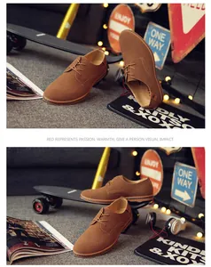 Detail view of brown frosted leather men's casual shoes in a street lifestyle setting
