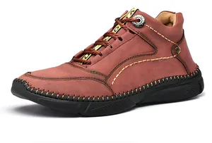 Close-up of reddish-brown leather men's casual outdoor shoe with hand-stitched detailing