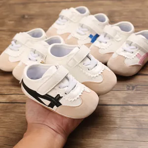Macro view showing the side stripe design of soft-soled baby walking shoes for infants