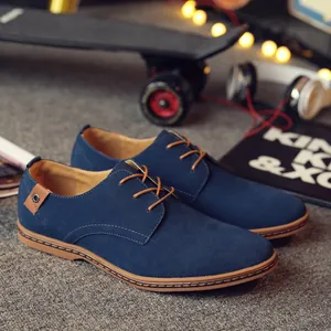 Men's navy blue suede casual derby shoes with non-slip brown soles, lifestyle view