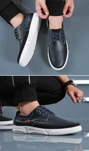 Detailed view of men's plus size navy casual leather shoes with thick white soles.