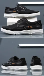 Detailed view of men's large size black casual leather shoes with thick white soles.
