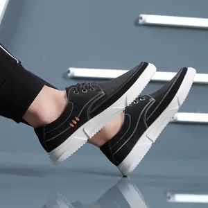Stylish black men's casual leather shoes with white soles and contrast stitching