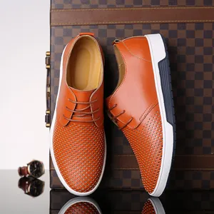 Stylish men's orange-brown hollow-out casual leather shoes with perforated breathable design