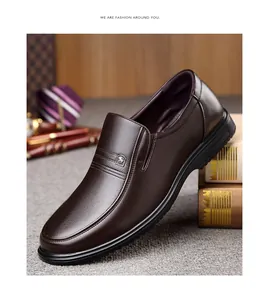 Detailed view of dark brown genuine leather men's business casual slip-on loafers.