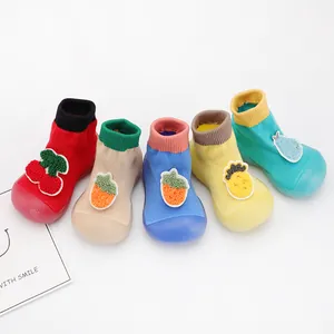 Detailed view of colorful baby sock shoes with soft non-slip soles