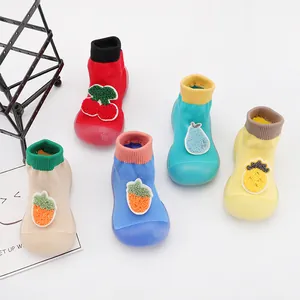 Collection of colorful breathable baby sock shoes with cute fruit patches and soft rubber soles