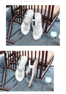 Detailed view of silver Bohemian T-strap sandals with rhinestone flowers from multiple angles