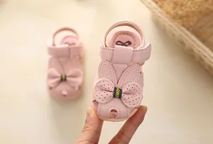 Pink princess baby sandals with cute bow detail and soft non-slip soles for toddlers