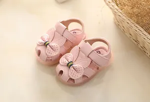 Pink princess baby girl sandals featuring adorable rabbit ear bow and soft non-slip sole