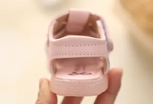 Rear view detail of pink baby girl walking sandal with soft non-slip sole