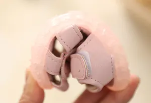 Detail view of the flexible soft sole on these pink baby girl princess sandals.