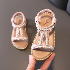 Elegant pink girl's Roman sandals decorated with pearls and rhinestones, open-toe shoes