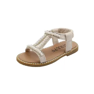 Elegant beige girl's Roman sandals with decorative pearls and sparkling rhinestones.