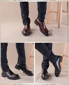 Detailweergave van herenschoenen van leer met krokodillenprint en dikke profielzool