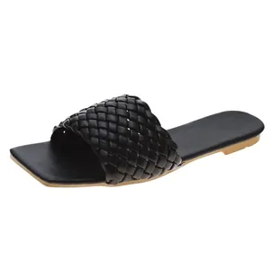 Fashionable black women's summer slide sandals featuring a stylish woven braided strap