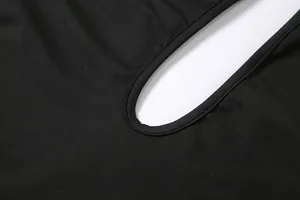 Detailed view of the cutout design and fabric texture of this black bodysuit