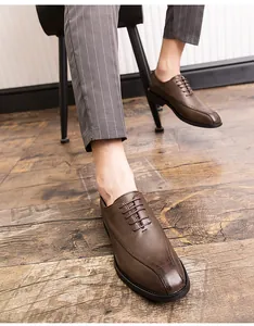Close-up of men's brown leather Oxford shoes showing fine texture and stitching