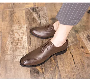 Detailed view of men's brown business casual leather shoes featuring a pointed toe design