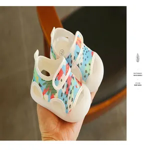 Toddler baby sandals with wrap-toe design and colorful soft sole for boys and girls.