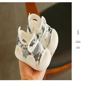 Close-up of breathable baby sandals with camouflage pattern and protective closed-toe design