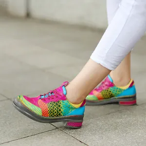 Side view of colorful vintage patchwork genuine leather loafers with round patterns for women