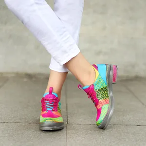 Close-up of vibrant retro leather shoes with colorful contrast patterns and lace-up details
