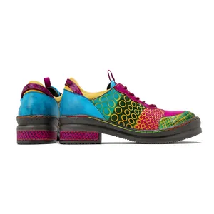 Detailed side view of colorful vintage genuine leather loafers with unique patchwork pattern