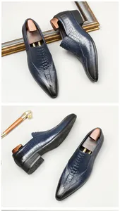Detailed view of men's navy blue crocodile embossed pointed toe loafers at multiple angles