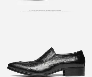 Professional side view of black men's leather loafers with crocodile pattern embossing