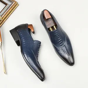 Men's blue crocodile embossed leather loafers with pointed toe for business casual wear.