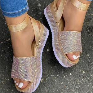 Detailed macro view of sparkling multi-color rhinestone embellished platform wedge sandals