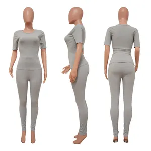 Grey ribbed two-piece yoga set for women, showing front, side and back views on mannequin