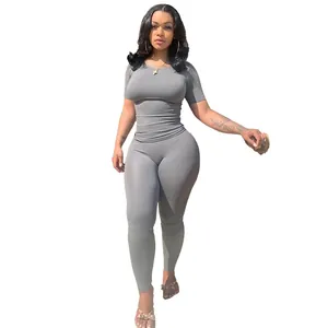 Detailed view of women's grey ribbed high-stretch two-piece sports outfit set