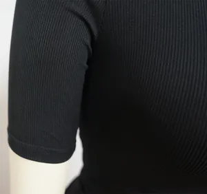 Close-up detail showing the texture of black ribbed high-elastic fabric on sports sleeve