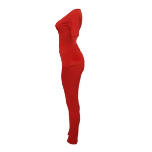 Side view of red ribbed high elastic two-piece sports set with slim fit leggings