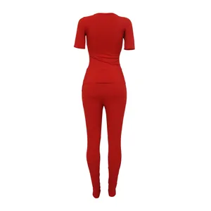 Back view of a vibrant red ribbed two-piece sports set with high elastic fabric texture