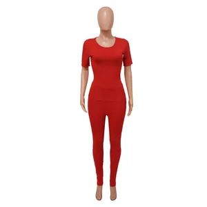 Full view of red ribbed knit two-piece sports set on mannequin with short sleeves