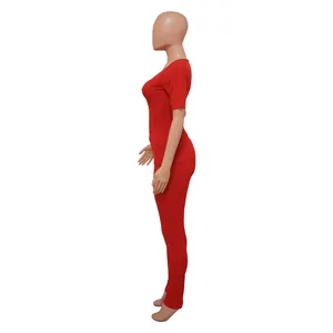 Side profile of women's red ribbed two-piece sports set with high elastic fabric fit