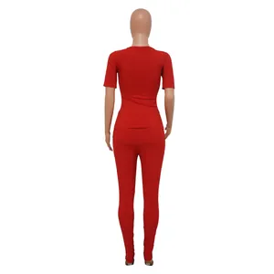 Back view of women's red ribbed high stretch sports two-piece set with leggings