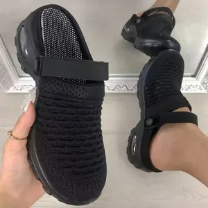 Detail of black fly-weave breathable mesh mules with platform air cushion sole