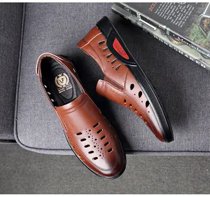 Close-up detail of breathable brown leather hollow-out men's casual dress sandals