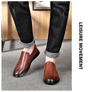 Close-up detail of brown men's breathable leather loafers with unique hollow-out design