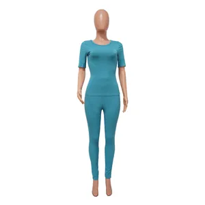 Detailed view of the turquoise rib-knit two-piece set with short sleeve top and leggings